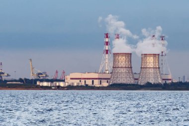 cooling tower, nuclear power plant on the shore. ecology, emissions, global warming clipart