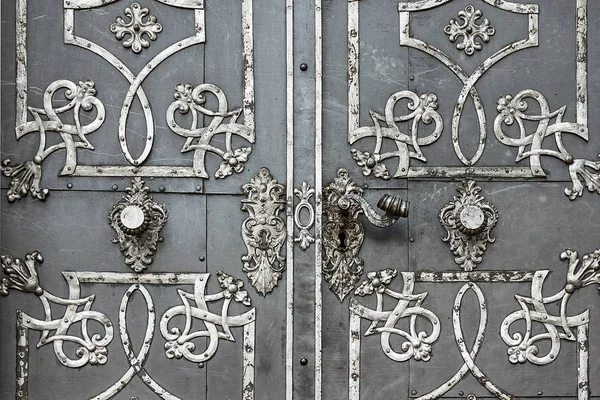 Antique iron doors with ornaments.