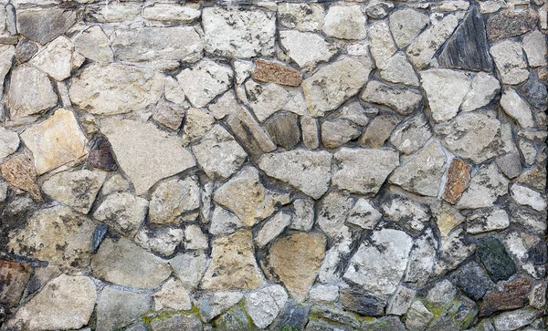 Textura da parede de pedras de diferentes formas — Fotografia de Stock