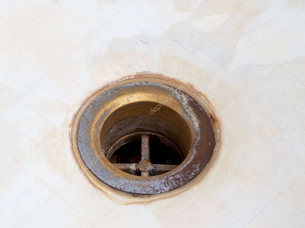 Bathroom drain dirty and rusty close up