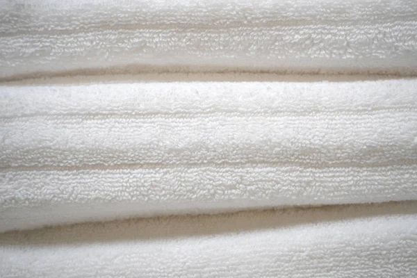 White cotton towels stacked on top of each other close up — Stock Photo, Image