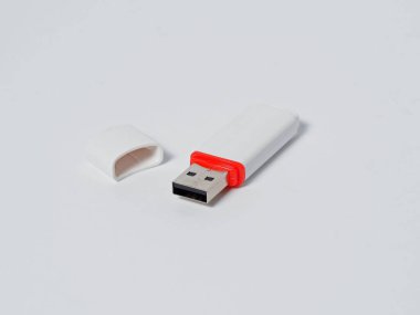 White usb flash drive isolated with a red stripe on the white background
