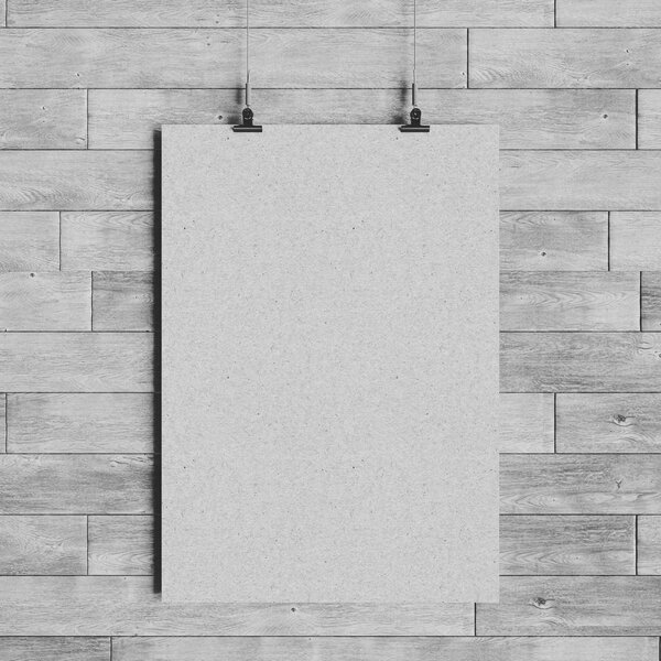 Black and white paper blank poster template hanging over wall. 3D illustration. High quality