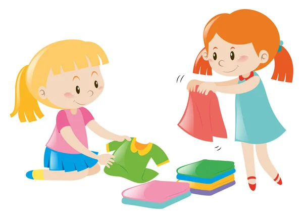 Two girls folding clothes — Stock Vector