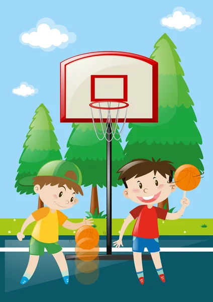 Two boys playing basketball in court