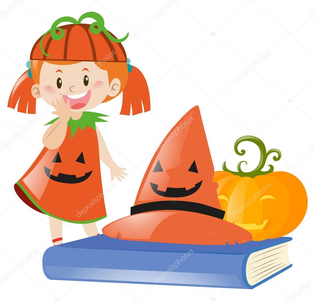 Girl in halloween costume as pumpkin