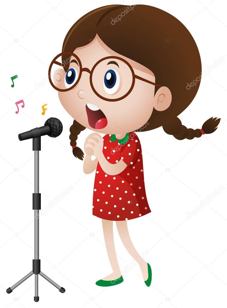 Happy girl singing on microphone