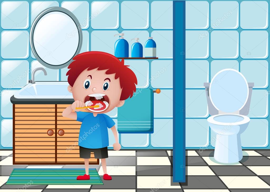 Boy brushing teeth in toilet