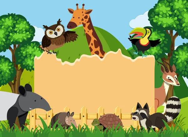 Border template with wild animals in park — Stock Vector