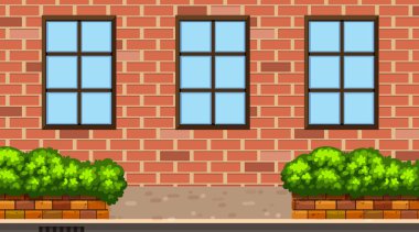 Tuğla bina ve çalılarla manzara