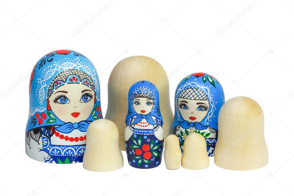 Three traditional Russian matryoshka dolls and blanks for painti