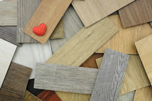 Laminate wood texture floor :oak tile, maple tile, chestnut tile, walnut tile, balsam tile, Samples of laminate and vinyl floor tile on wooden Background. Laminate use in the house, Hospital, Townhouse, Condominium, Hotel, Apartment, Department — Stock Image Laminate wood texture floor :oak tile, maple tile, chestnut tile, walnut tile, balsam tile, Samples of laminate and vinyl floor tile on wooden Background. Laminate use in the house, Hospital, Townhouse, Condominium, Hotel, Apartment, Department Royalty Free Stock Photos