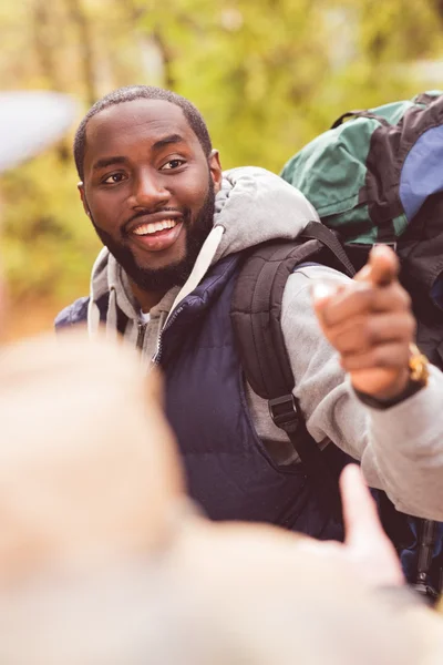Young smiling man backpacker — Stock Photo, Image
