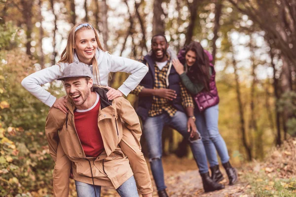 Happy friends having fun in forest — Stock Photo, Image