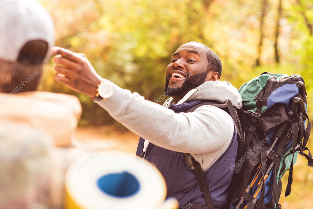 Young smiling man backpacker 