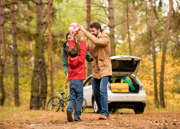 Happy family playing with ball — Stock Photo, Image