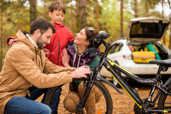 Happy family with bicycle
