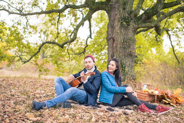 Romantic couple in autumn forest