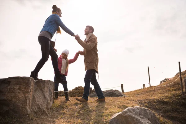 Happy family holding hands — Stock Photo, Image