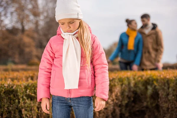 Sad little girl standing outdoors — Stock Photo, Image