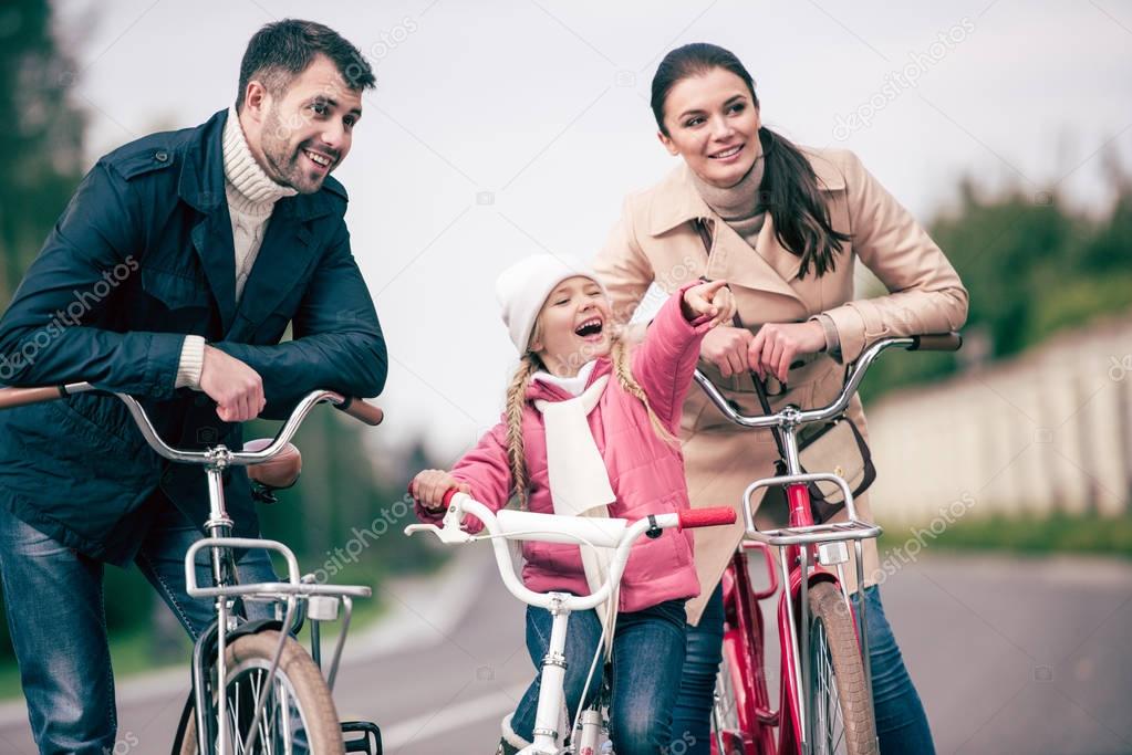 Happy family with bicycles