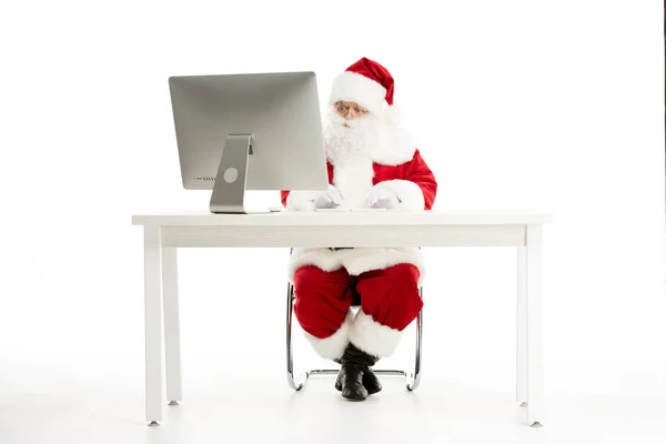 Santa Claus using computer — Stock Photo, Image