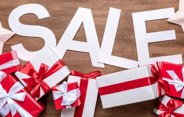 Sale sign with gift boxes — Stock Photo, Image