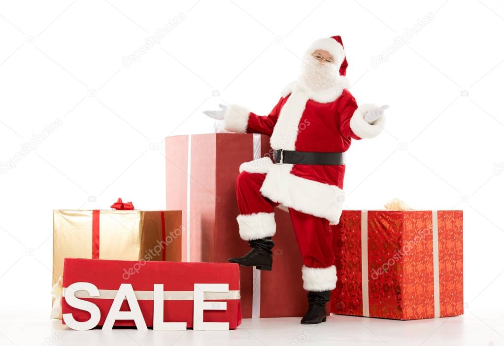 Happy Santa Claus with Sale sign 