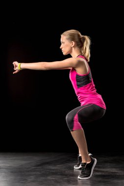 Athletic woman exercising clipart