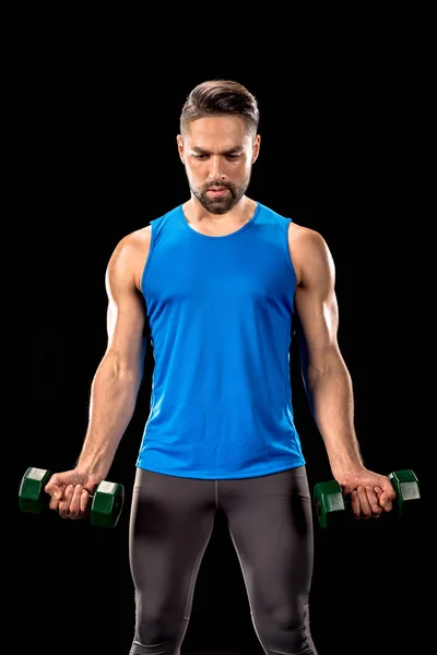 Sportive man with dumbbells — Free Stock Photo