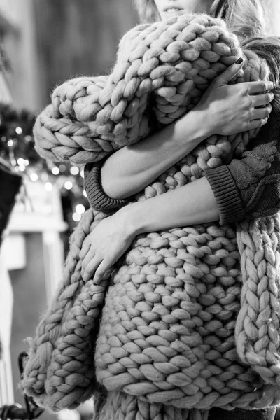 Young woman holding knitted cloth — Stock Photo, Image