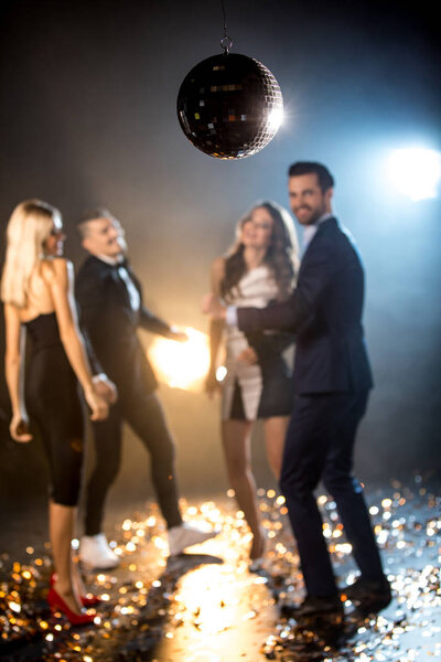 Friends dancing in nightclub 