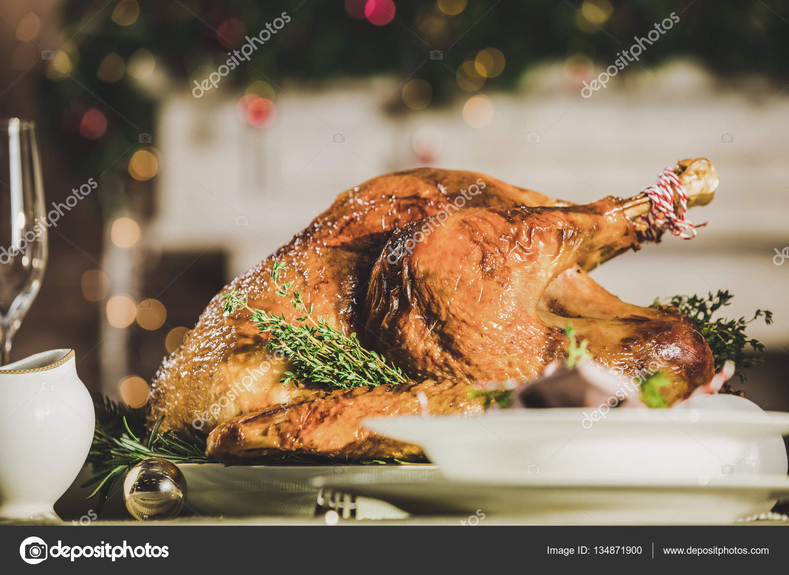 Roasted turkey on holiday table Stock Photo by ©ArturVerkhovetskiy ...