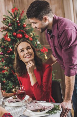 Smiling couple at holiday table