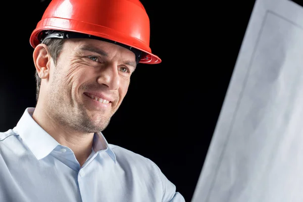 Male engineer with blueprint — Stock Photo, Image
