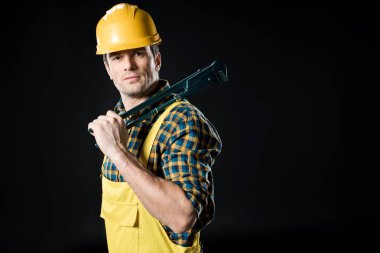 Worker holding pipe wrench clipart