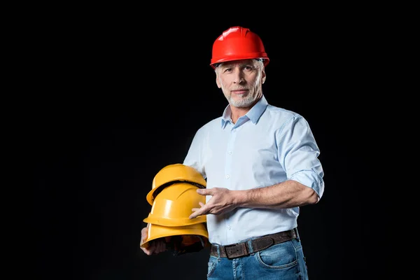 Man holding hard hats — Stock Photo, Image