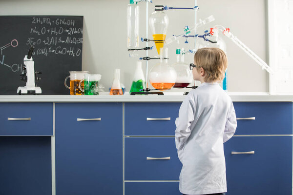 Boy in science laboratory