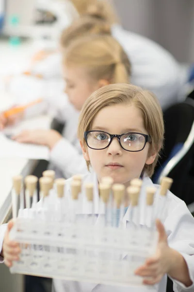 Boy with test tubes — Stock Photo, Image