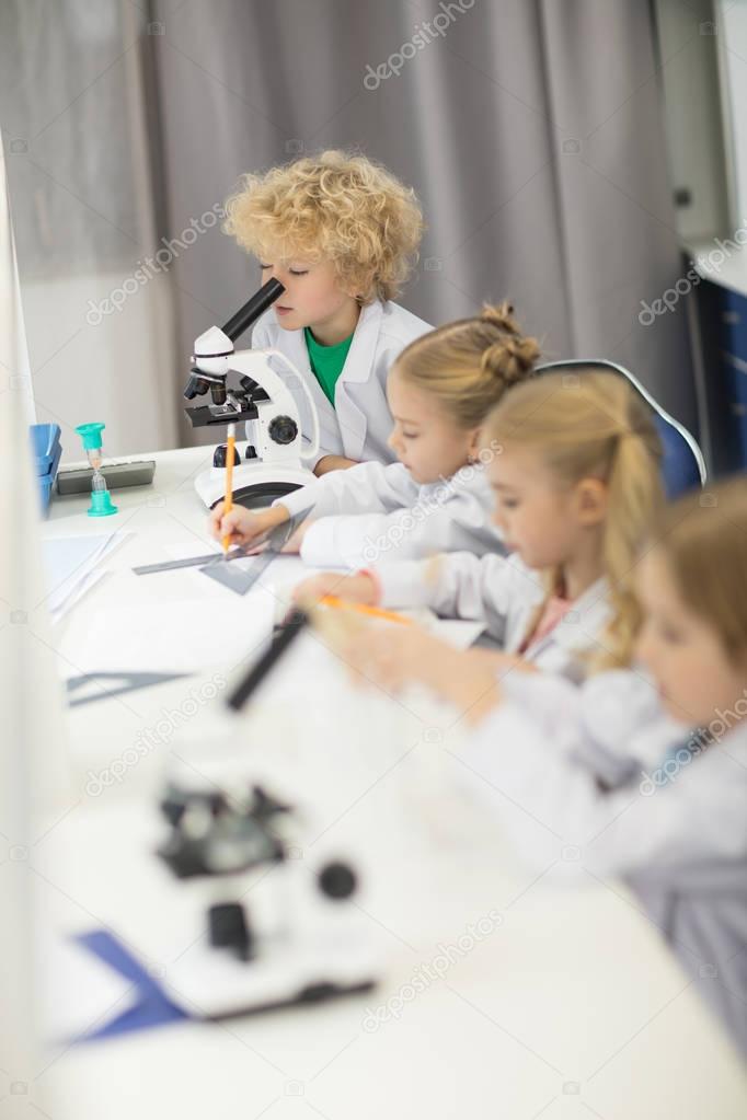 Kids studuing in laboratory