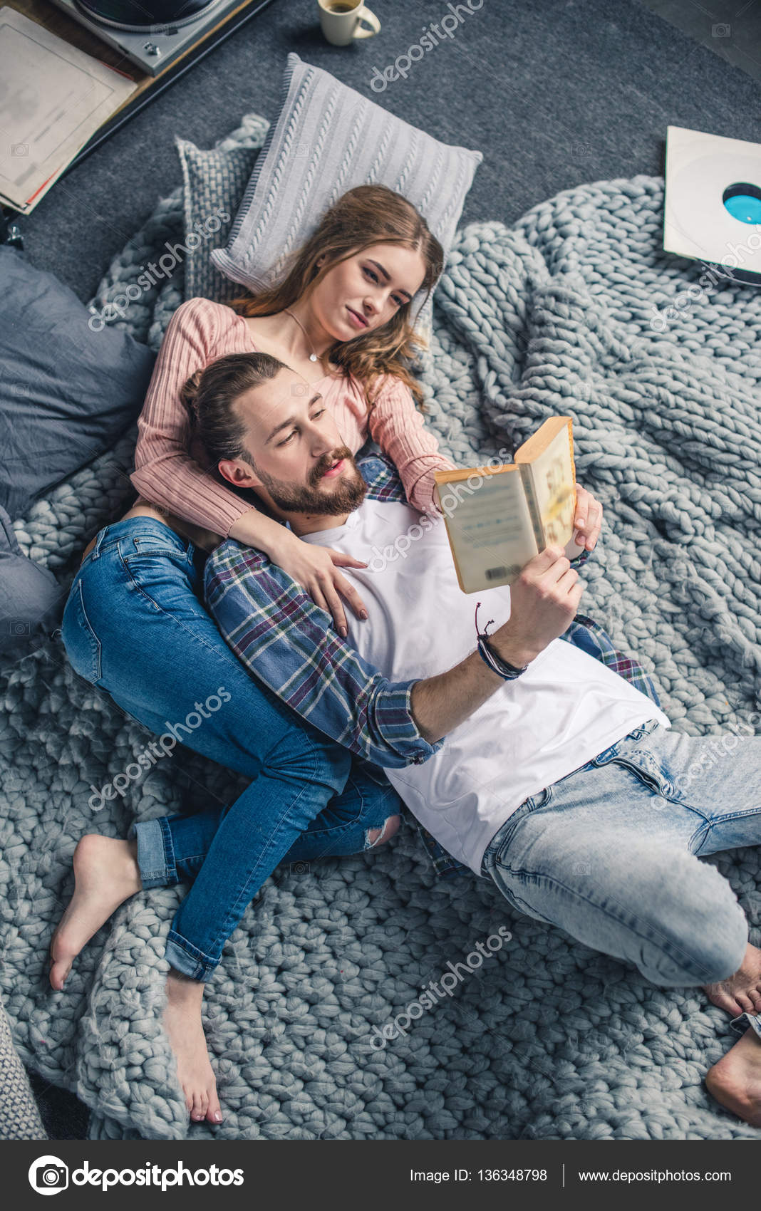 Couple reading book Stock Photo by ©ArturVerkhovetskiy 136348798