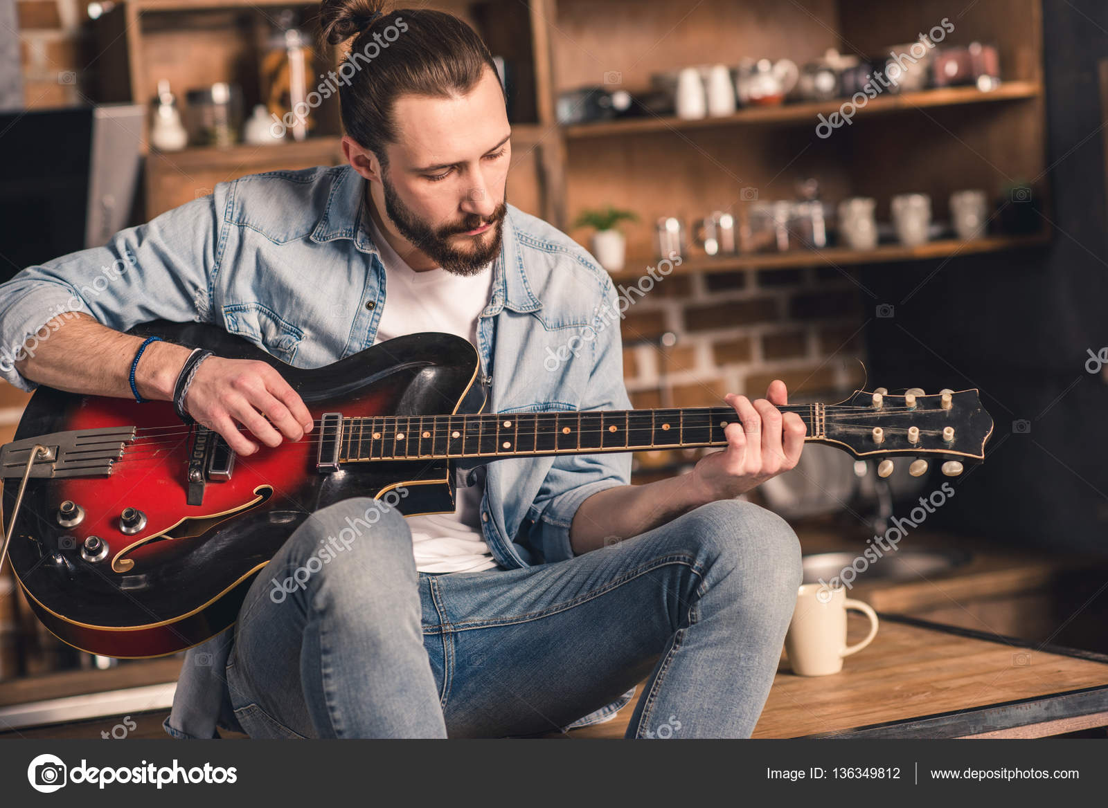 Man playing guitar Stock Photo by ©ArturVerkhovetskiy 136349812