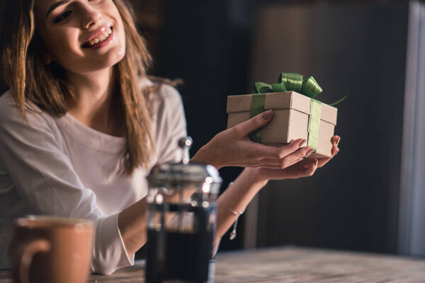 Young woman with gift box