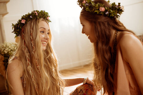 bohemian women in floral wreaths