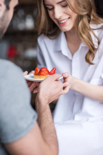 Couple with strawberry cake — Stock Photo, Image