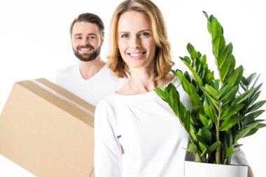 Couple holding box and plant clipart