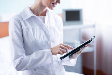 Doctor with digital tablet clipart