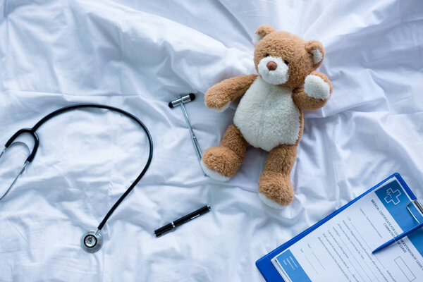 Medical tools and teddy bear