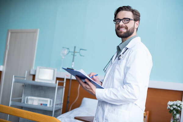 Male doctor with clipboard