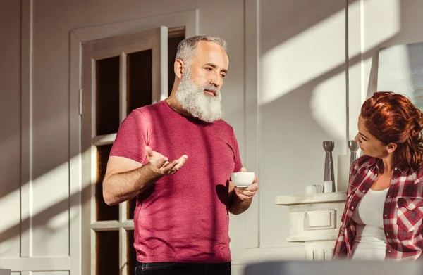 Mature man talking with woman — Stock Photo, Image